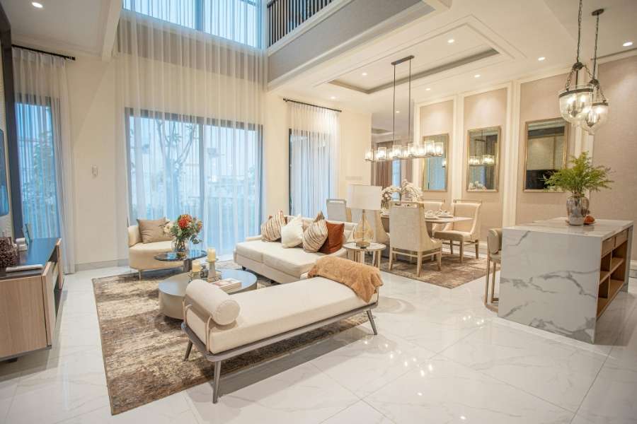 Modern minimalist living room interior with stylish globe wall lights and a wooden armchair.